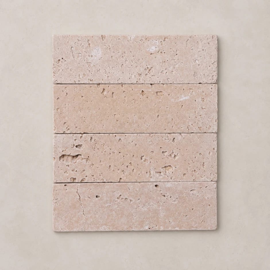Subway Rome tumbled natural travertine in a 45 by 150mm subway format, warm ivory stone.