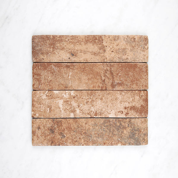 London Brick porcelain laid in a running brick bond, warm rustic brick tones offset row by row.