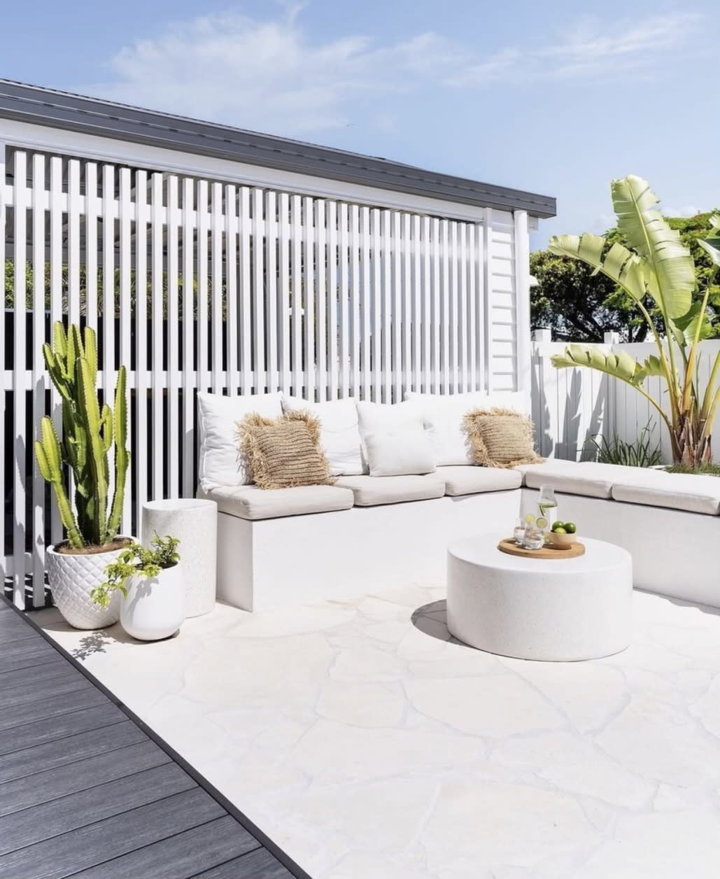 Crema Siena limestone crazy paving outdoors, irregular cream stone pieces fitted together like a jigsaw.
