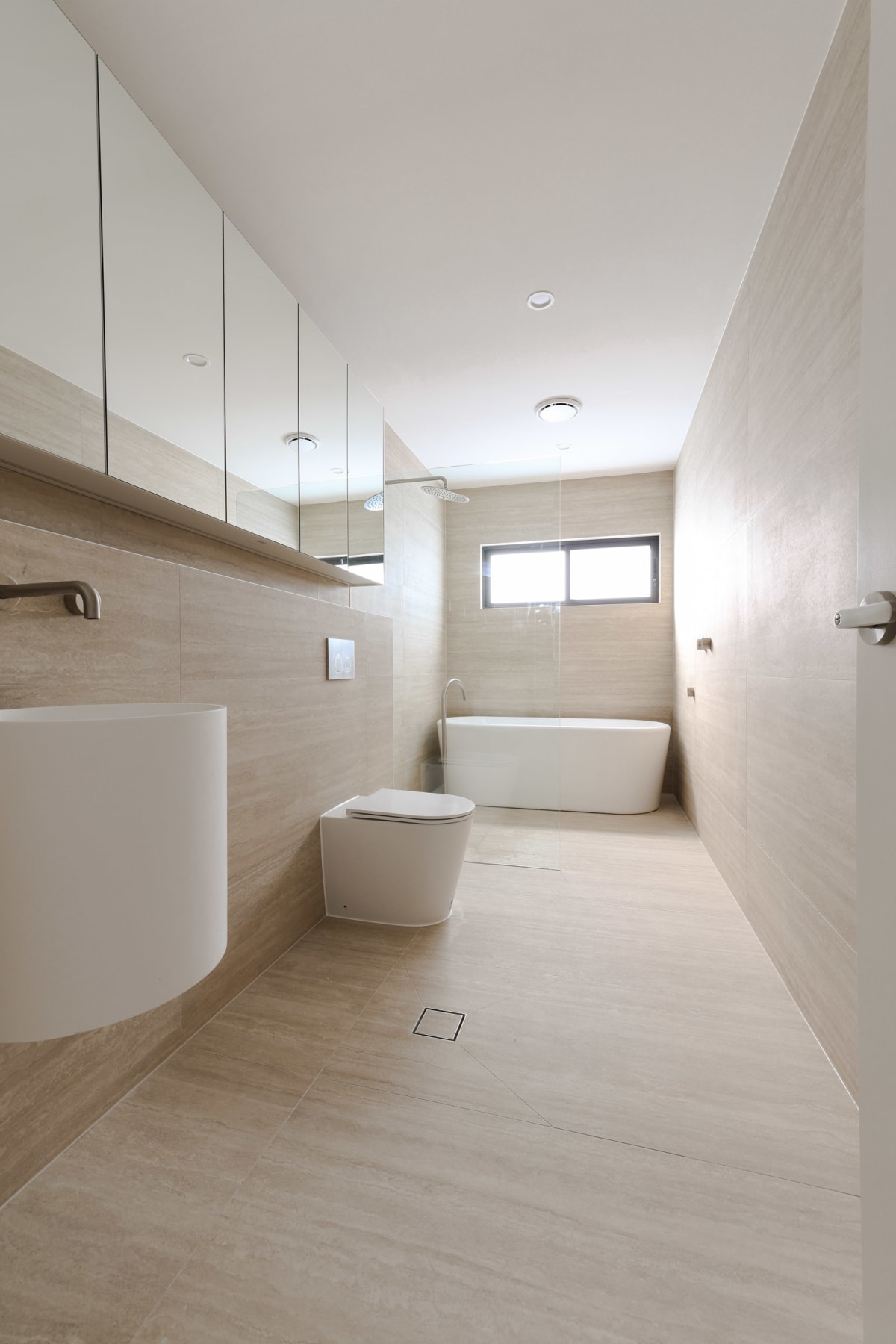 Modern Luxury Duplex in Sylvania – Limestone Look & Travertine Tiles Create Cohesion – Family Bathroom Upstairs – Travertine Look Tile for Scale