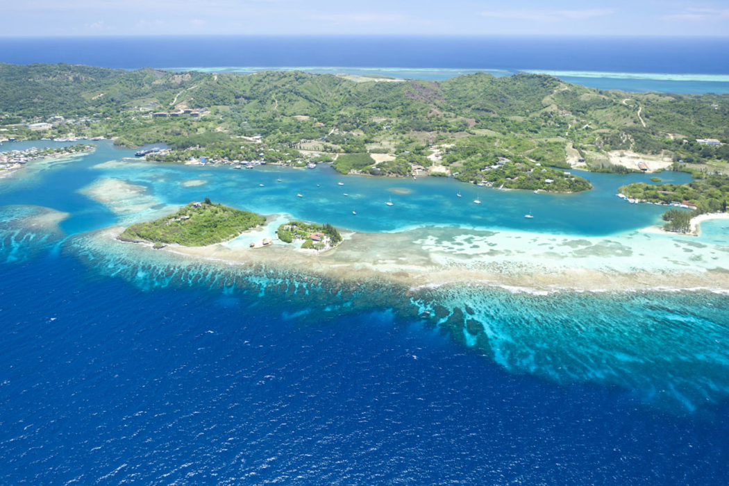 Aerial view of the Bay Islands showing the Mesoamerican Barrier Reef and pristine Caribbean waters