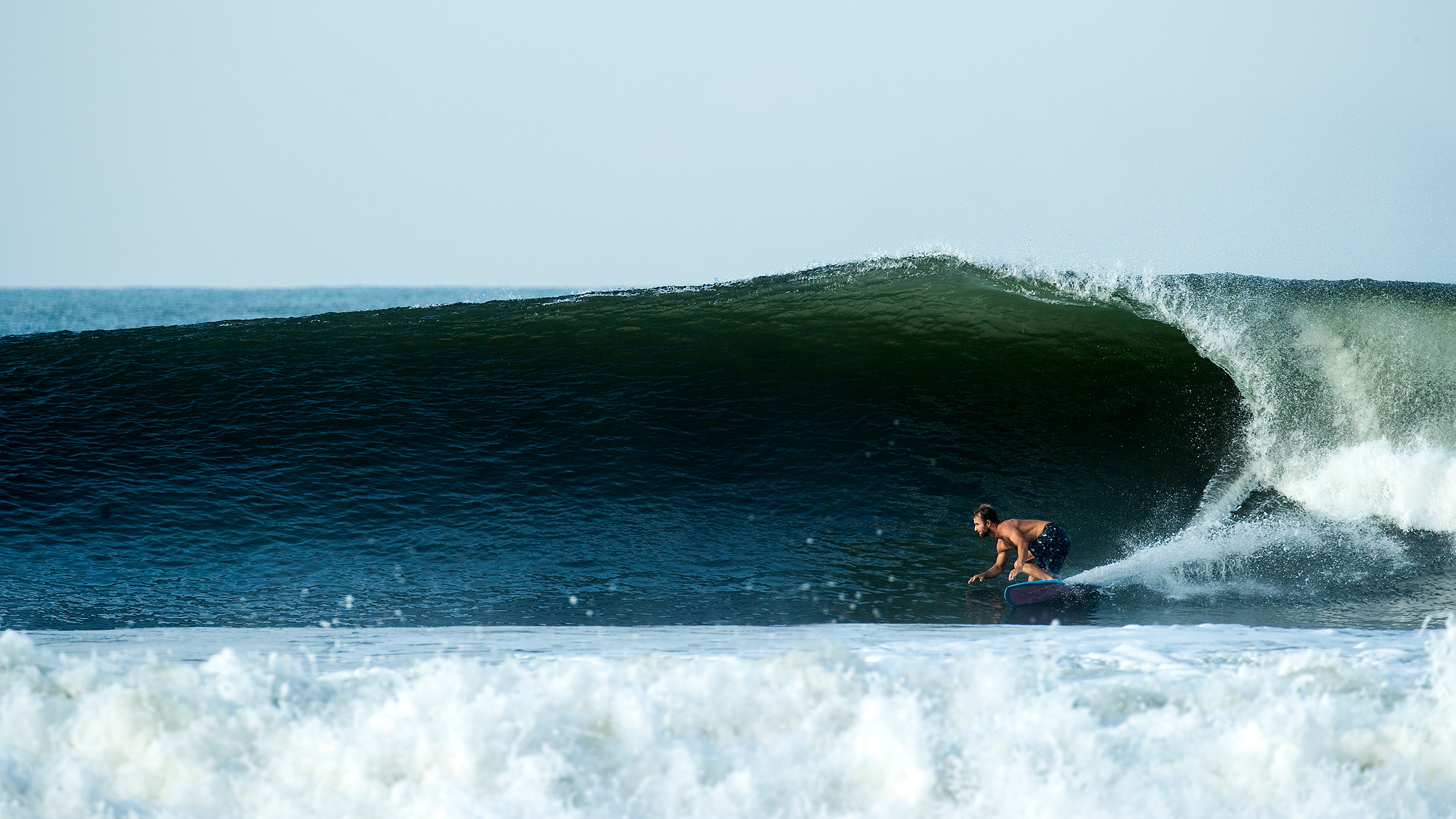 Surfer riding inside a barrel wave at El Zonte, El Salvador