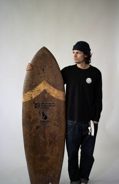 Mycelium surfboard prototype showing the natural hemp-fibre biocomposite structure