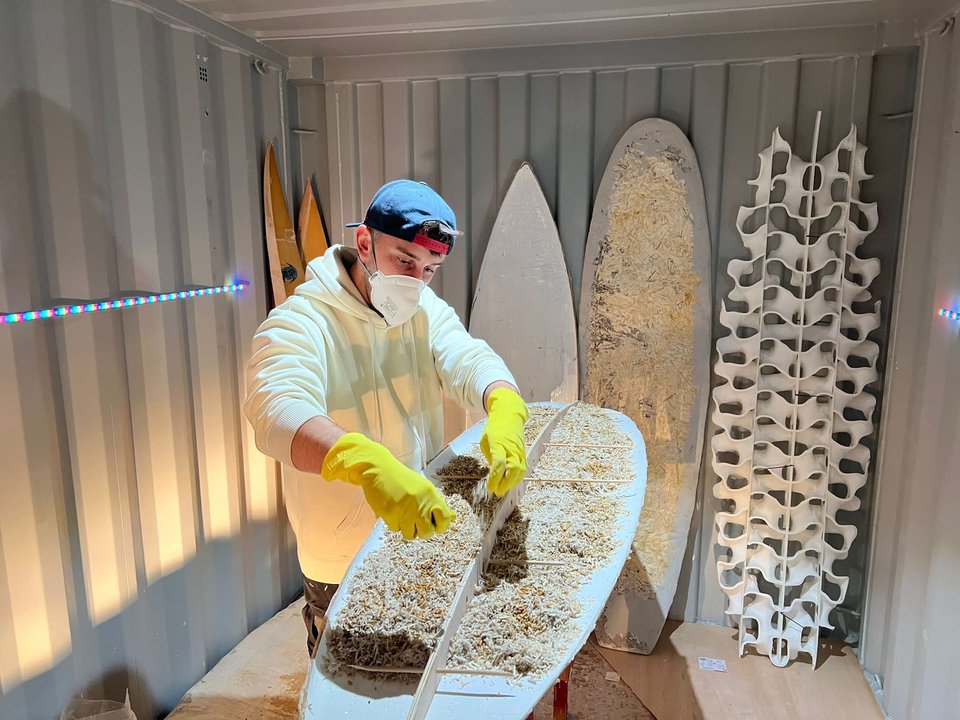 Steve Davies with his mycelium surfboard — a biodegradable board grown from fungi