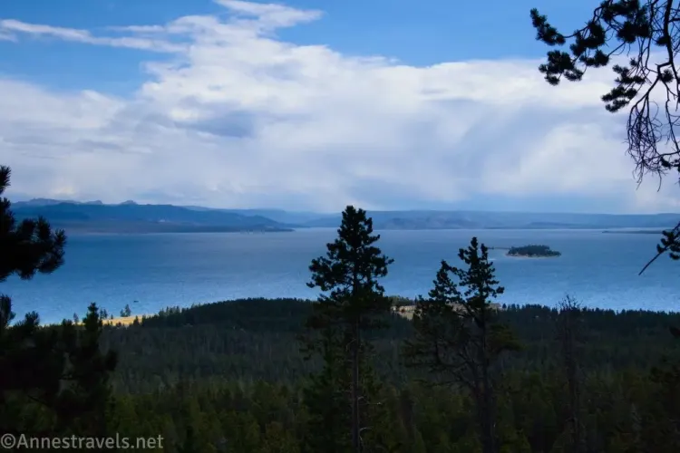 Clouds over a lake and silhouetted trees