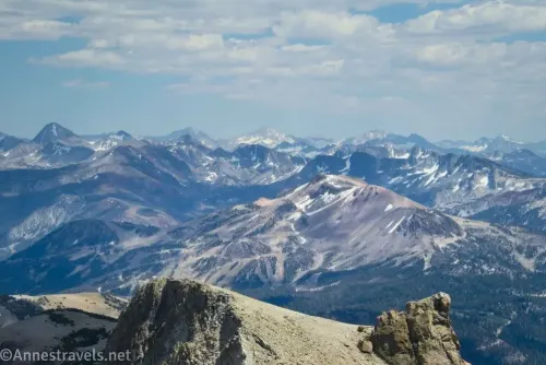 Many snow-streaked mountain peaks