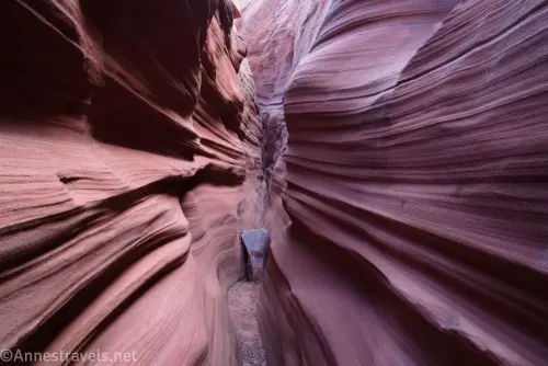 Sculped stripes on the walls of a very narrow slot canyon 