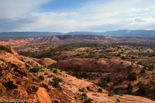 Views across the desert including slickrock hills and cliffs 