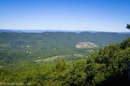 Green mountains and a green valley below blue skies from the Tinker Cliffs along the Appalachian Trail
