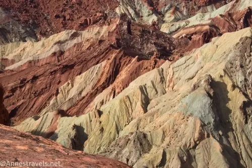 Yellow, red, gray, brown, and orange badlands in the crater of Upheaval Dome