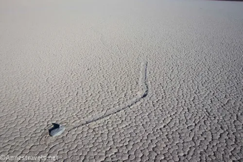 A rock with a trail from where it moved across the Racetrack Playa 