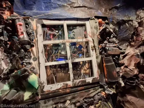 A lot of trash and a window at the Mole of the Mountain escape room at Upside Down Escape Games in Mashpee, Massachusetts