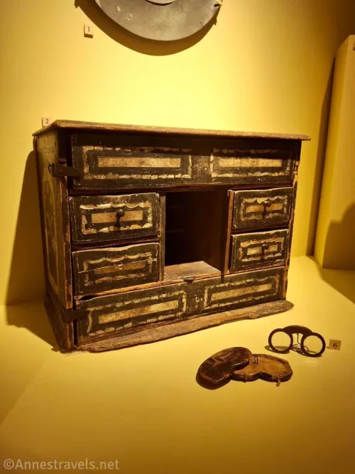 Eyeglasses and a wooden set of drawers from the Pilgrim era in the basement of Pilgrim Hall, Plymouth, Massachusetts