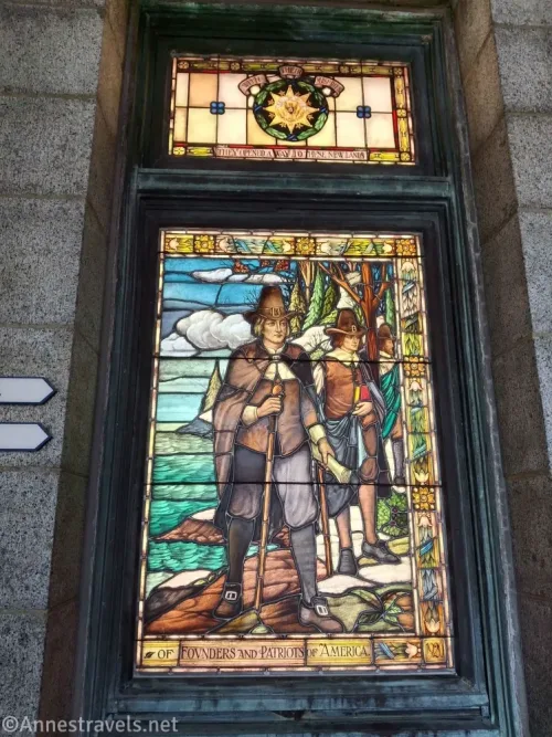 A stained glass window of Pilgrim men in the reception area of Pilgrim Hall, Plymouth, Massachusetts