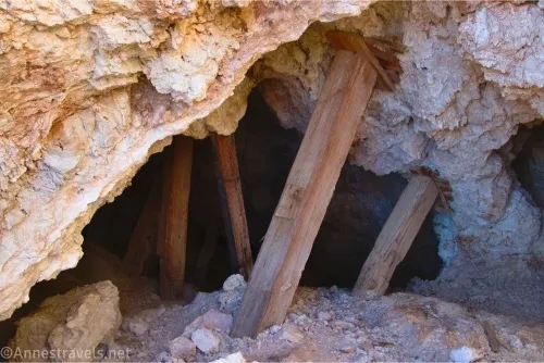 Wooden supports in a hole in a rock 