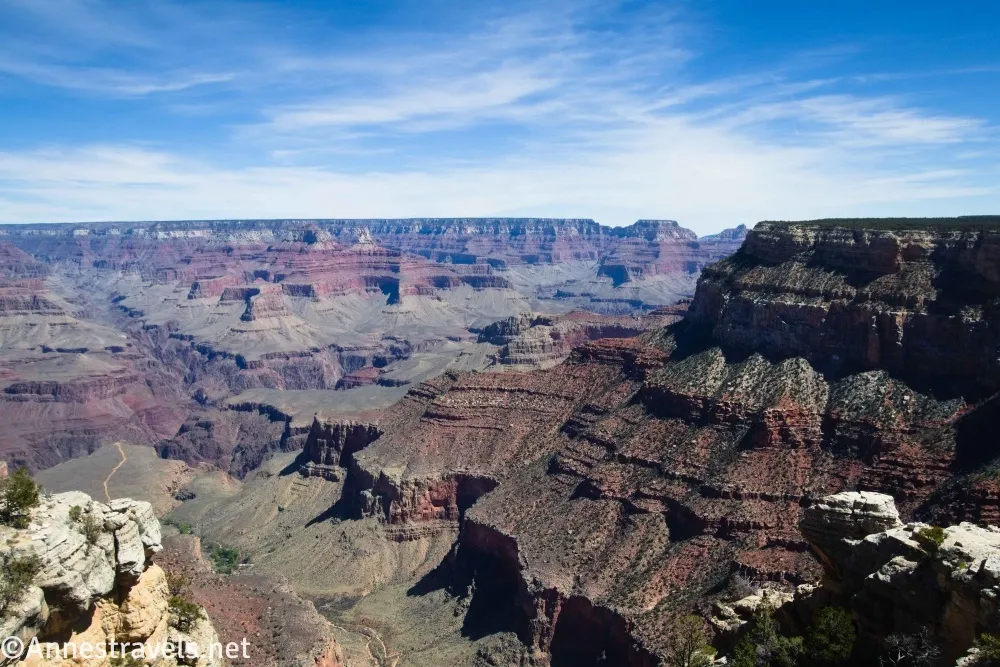 The Grand Canyon below clouds in a blue sky