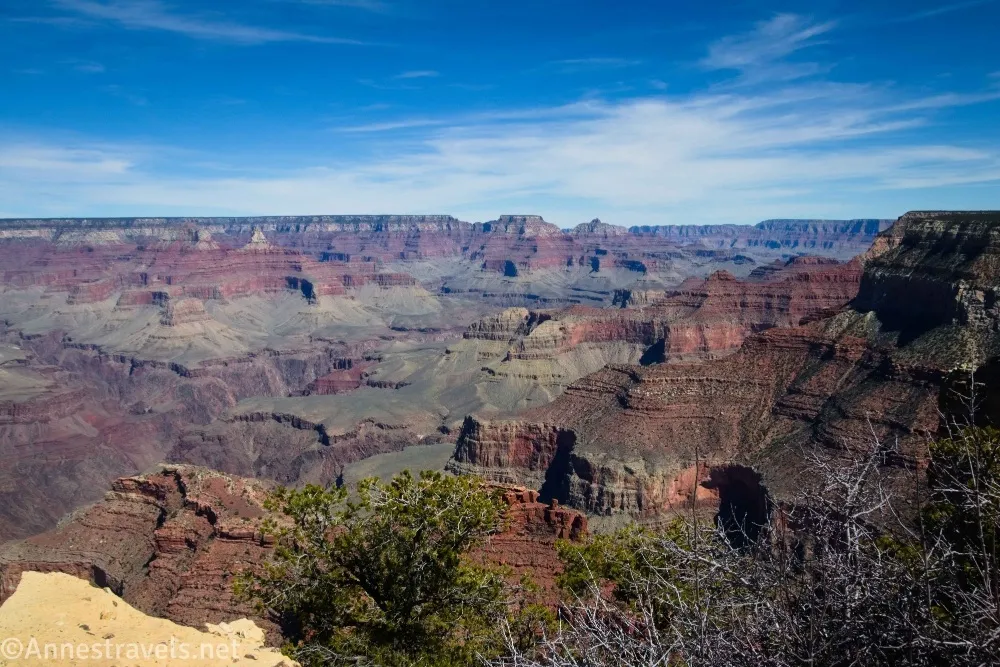Buttes of the Grand Canyon under blue skies with clouds