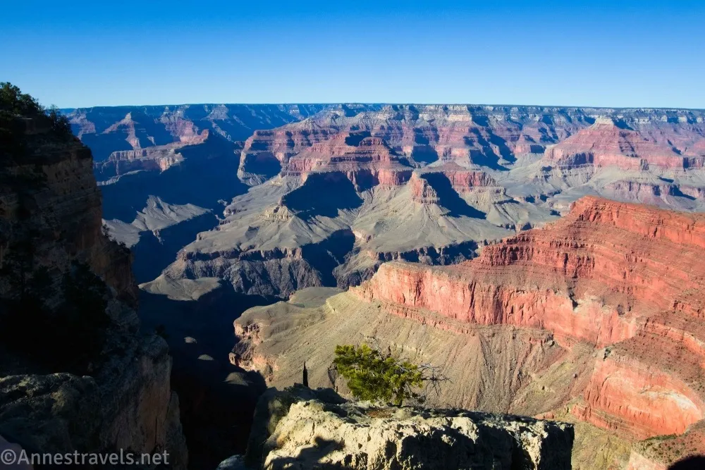 A red cliff and more buttes in the Grand Canyon