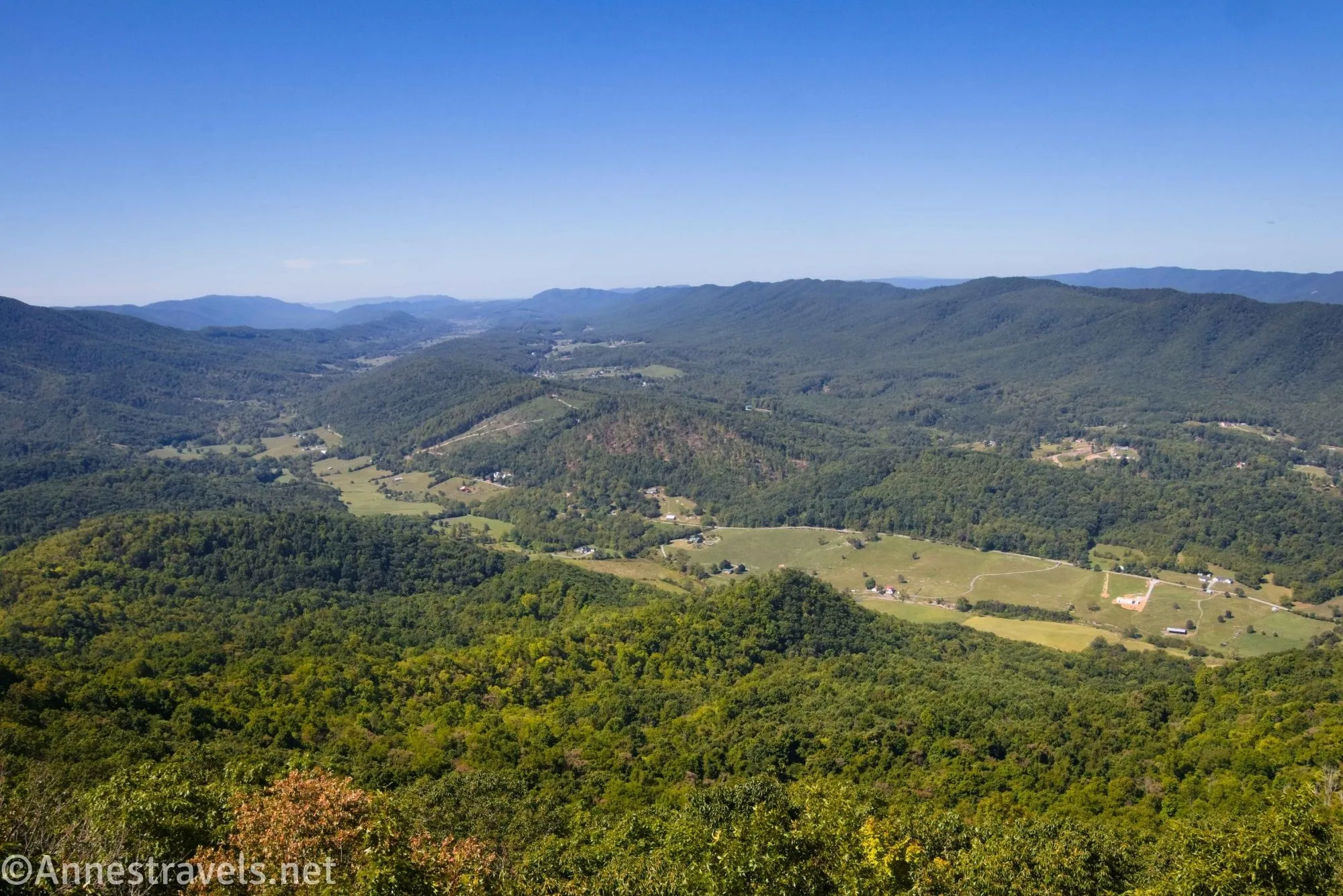 Houses, fields, and green mountains from Tinker Cliffs along the Appalachian Trail in the Blue Ridge Mountains of Virginia