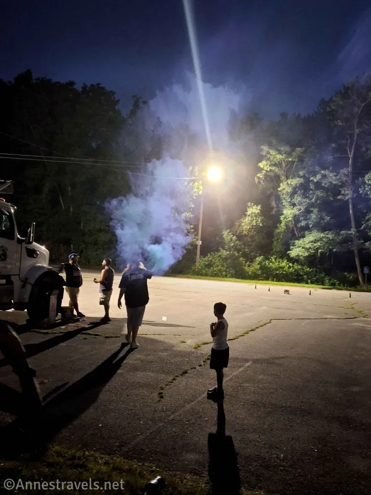 People and smoky fireworks