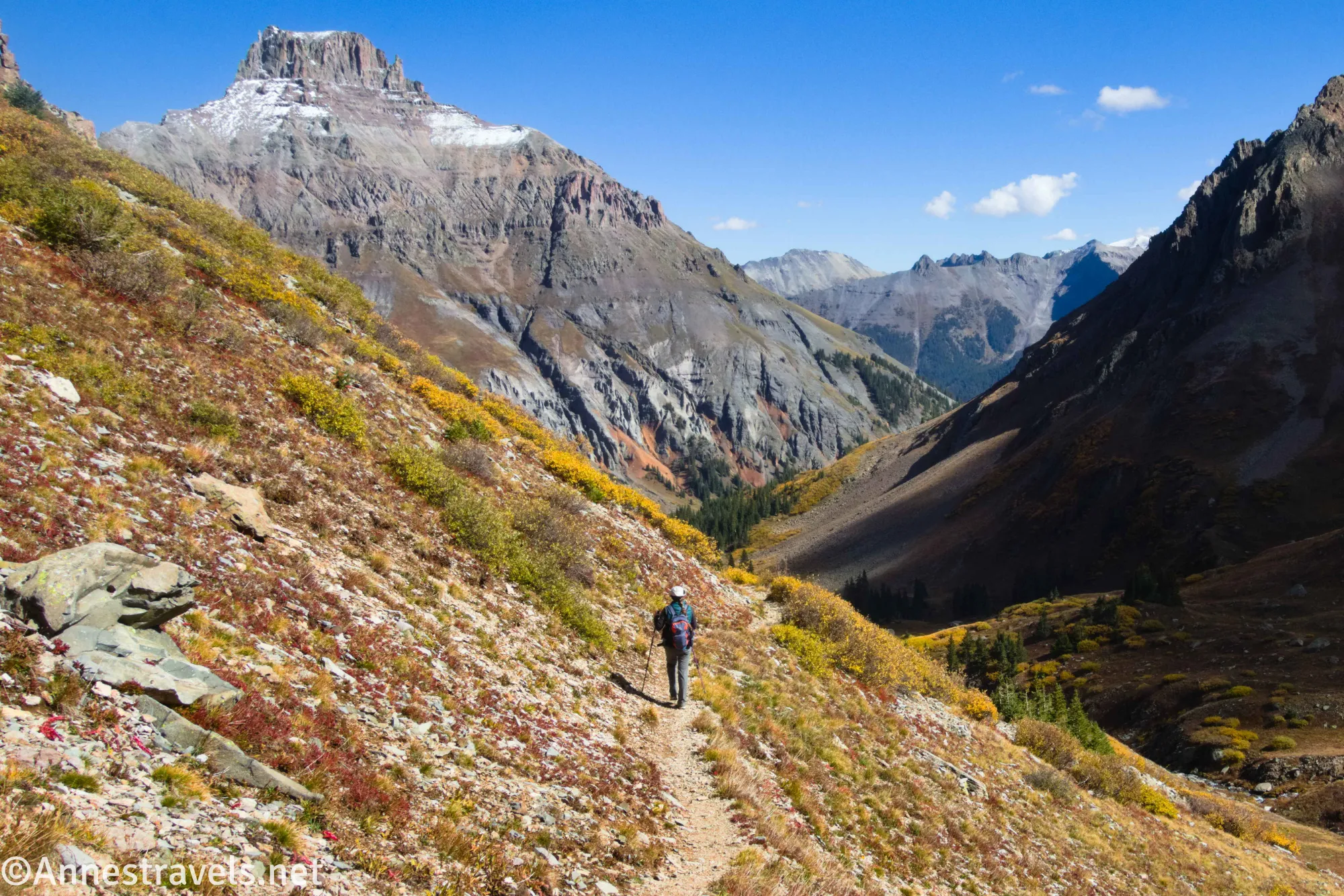A hiker on the trail below Yankee Boy Basin near Ouray in the San Juan Mountains of Colorado