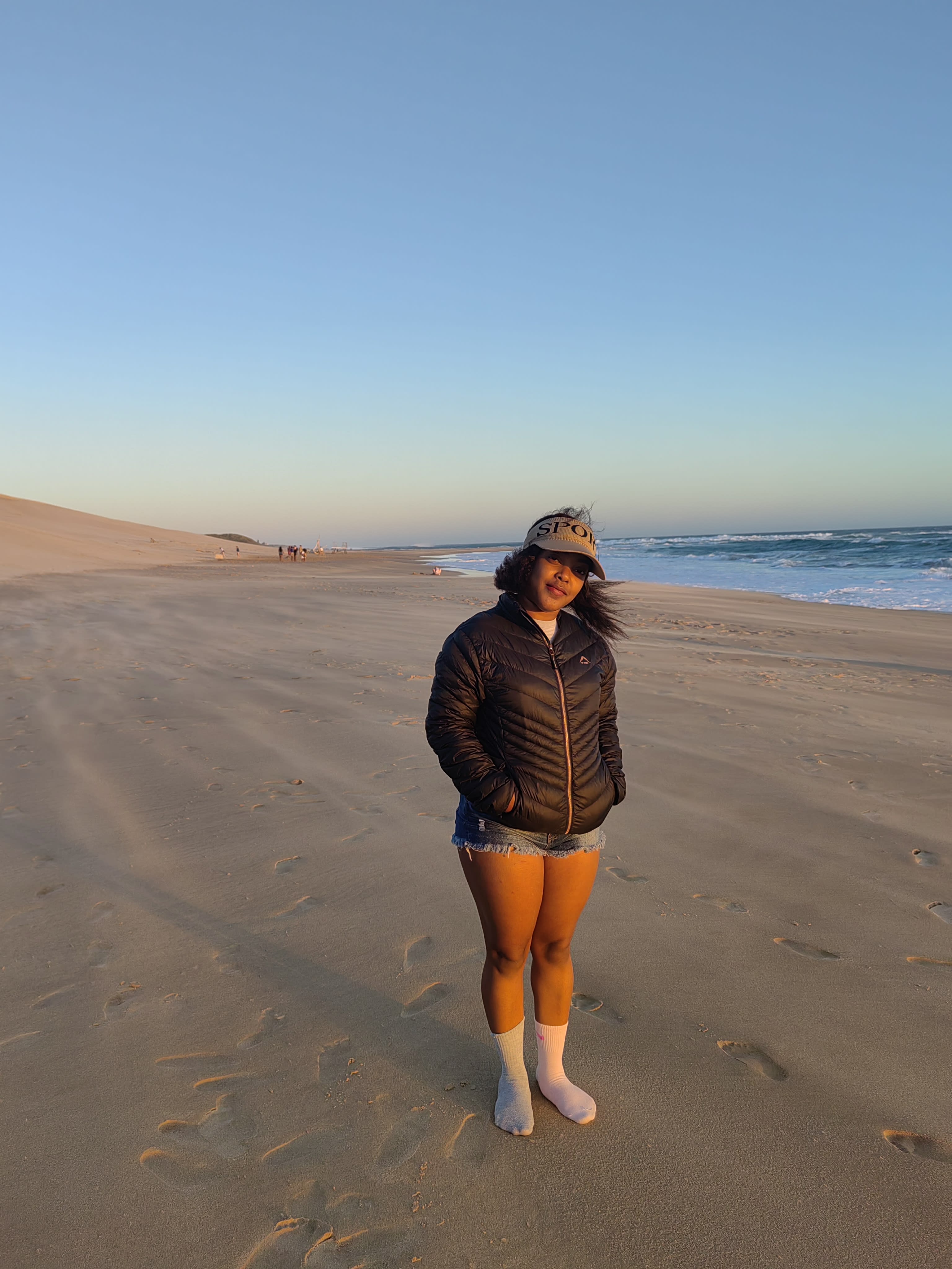 Full length at dusk in a bucket hat