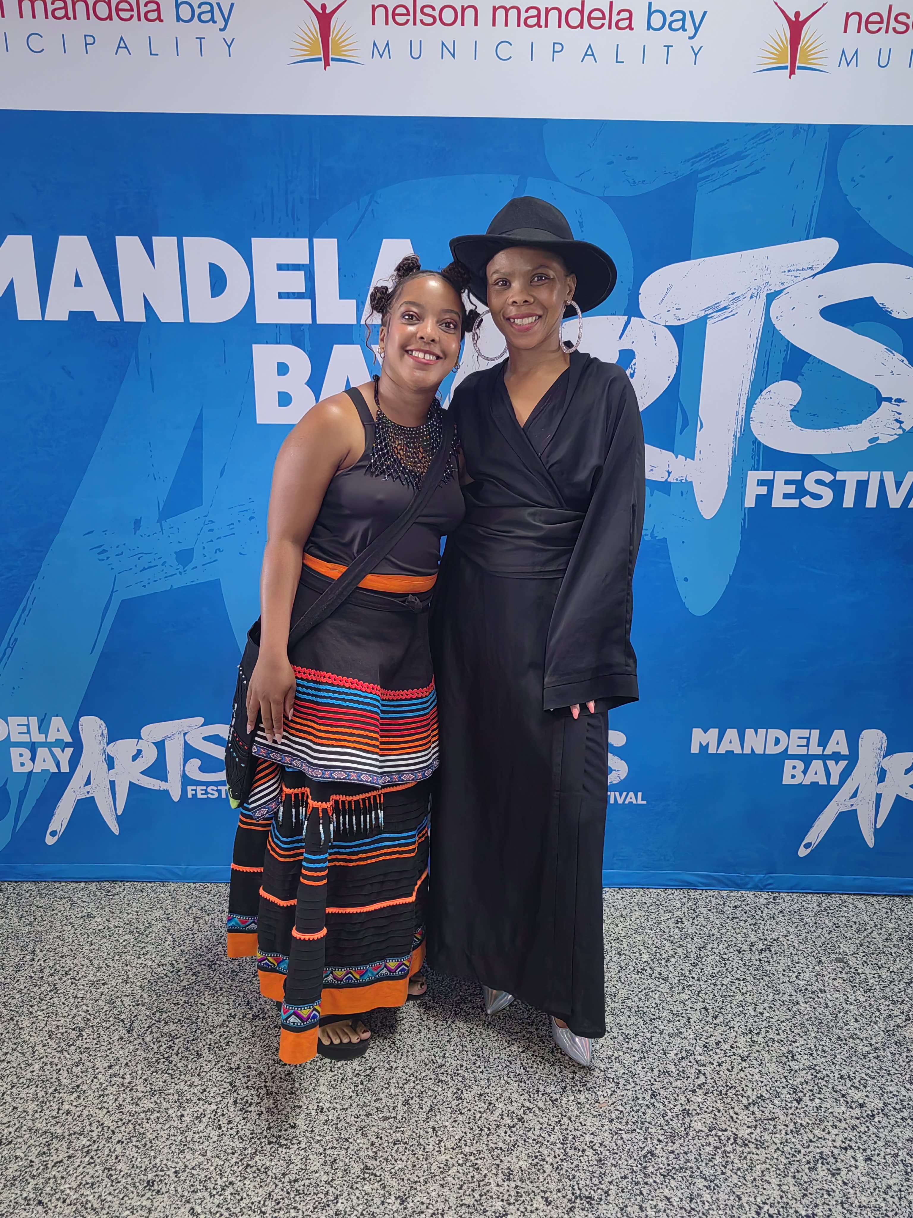 A warm duo in regalia at the festival