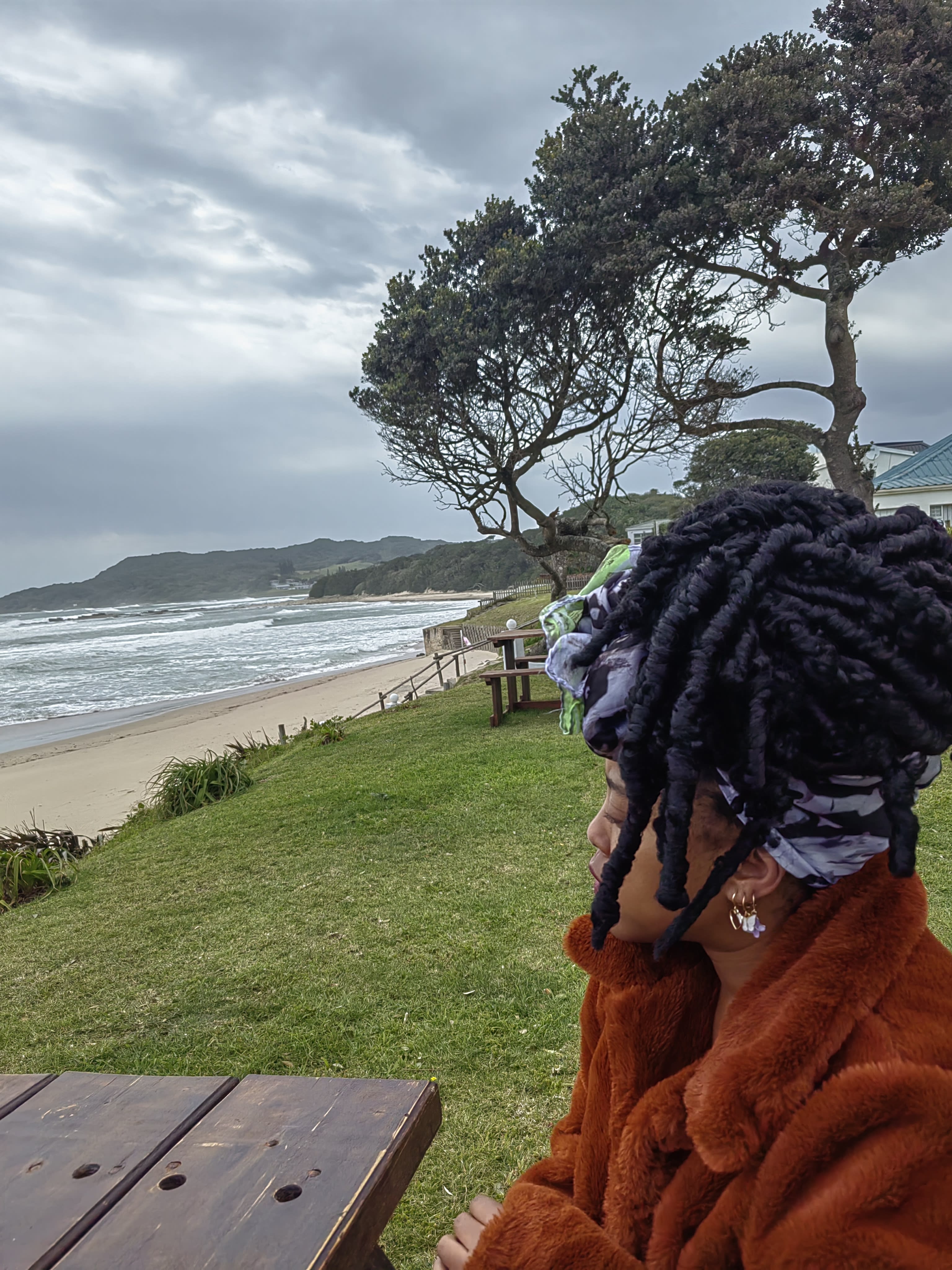 Back of the head to a moody grey sea