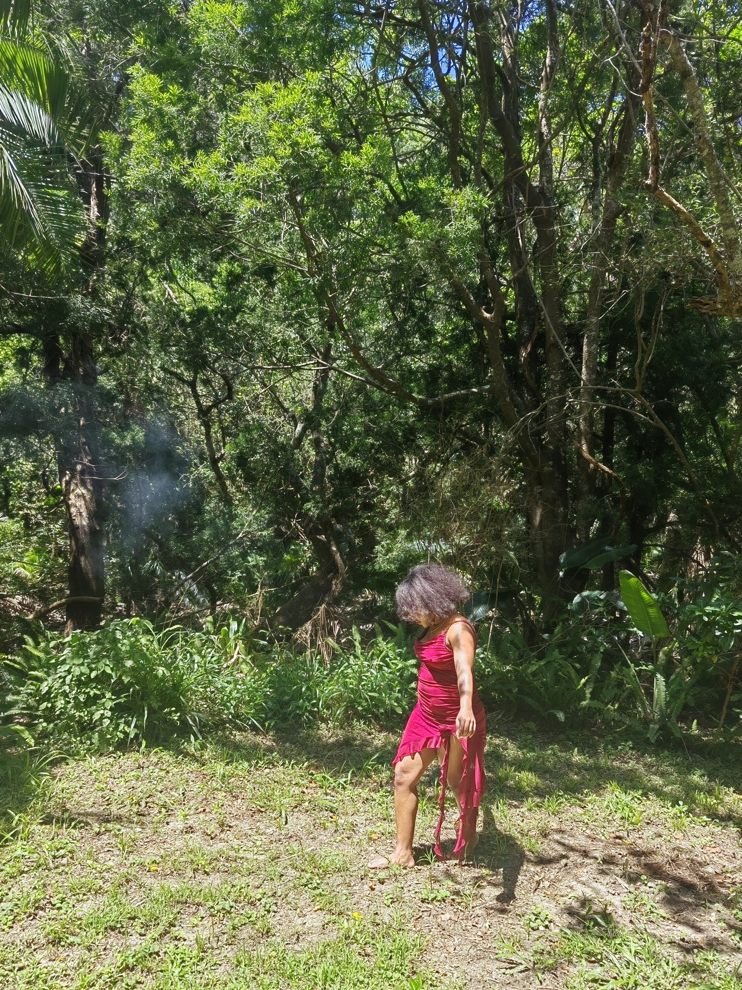 Barefoot, mid-dance in red