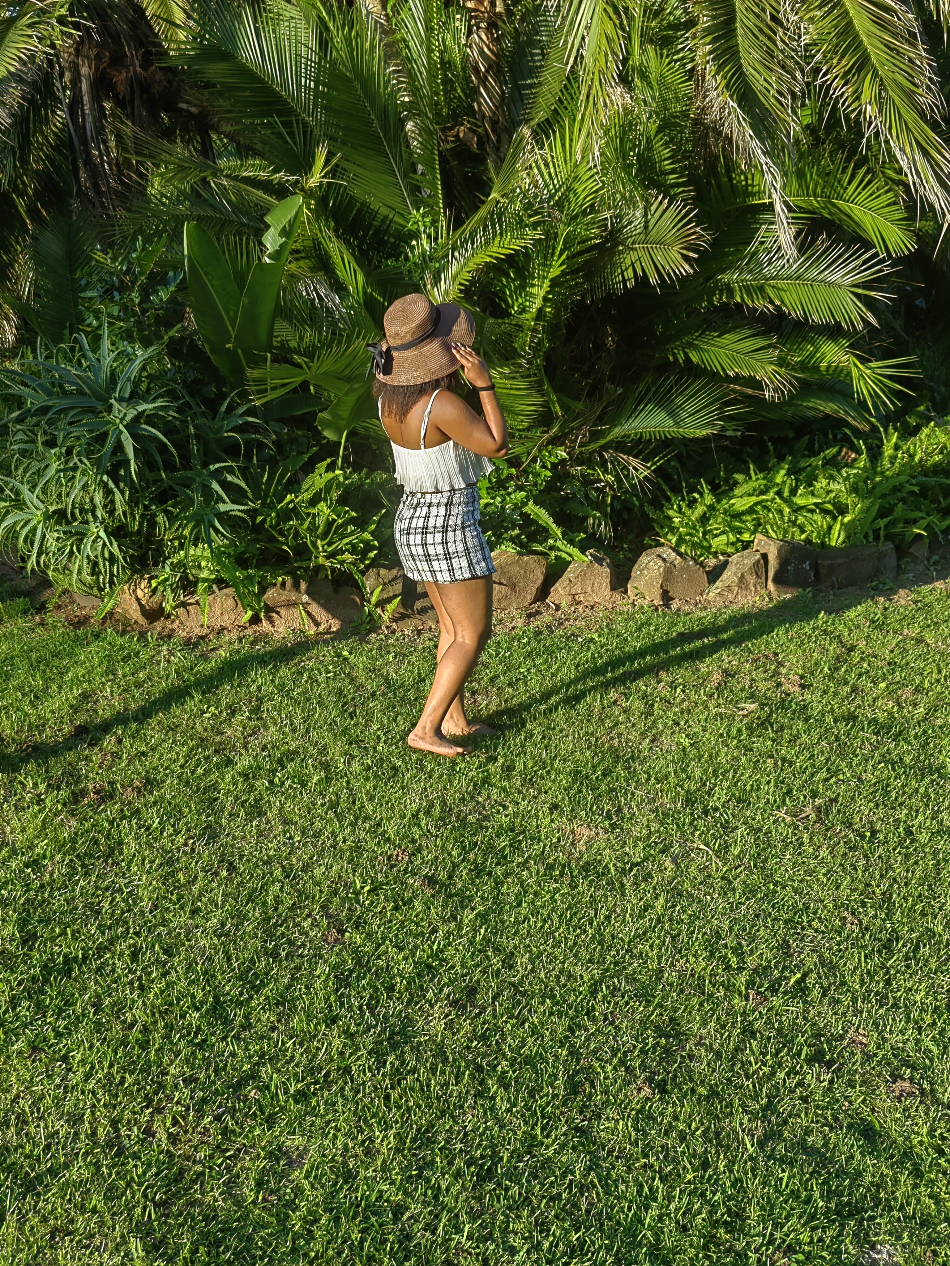 Nanda in a tropical garden at golden hour