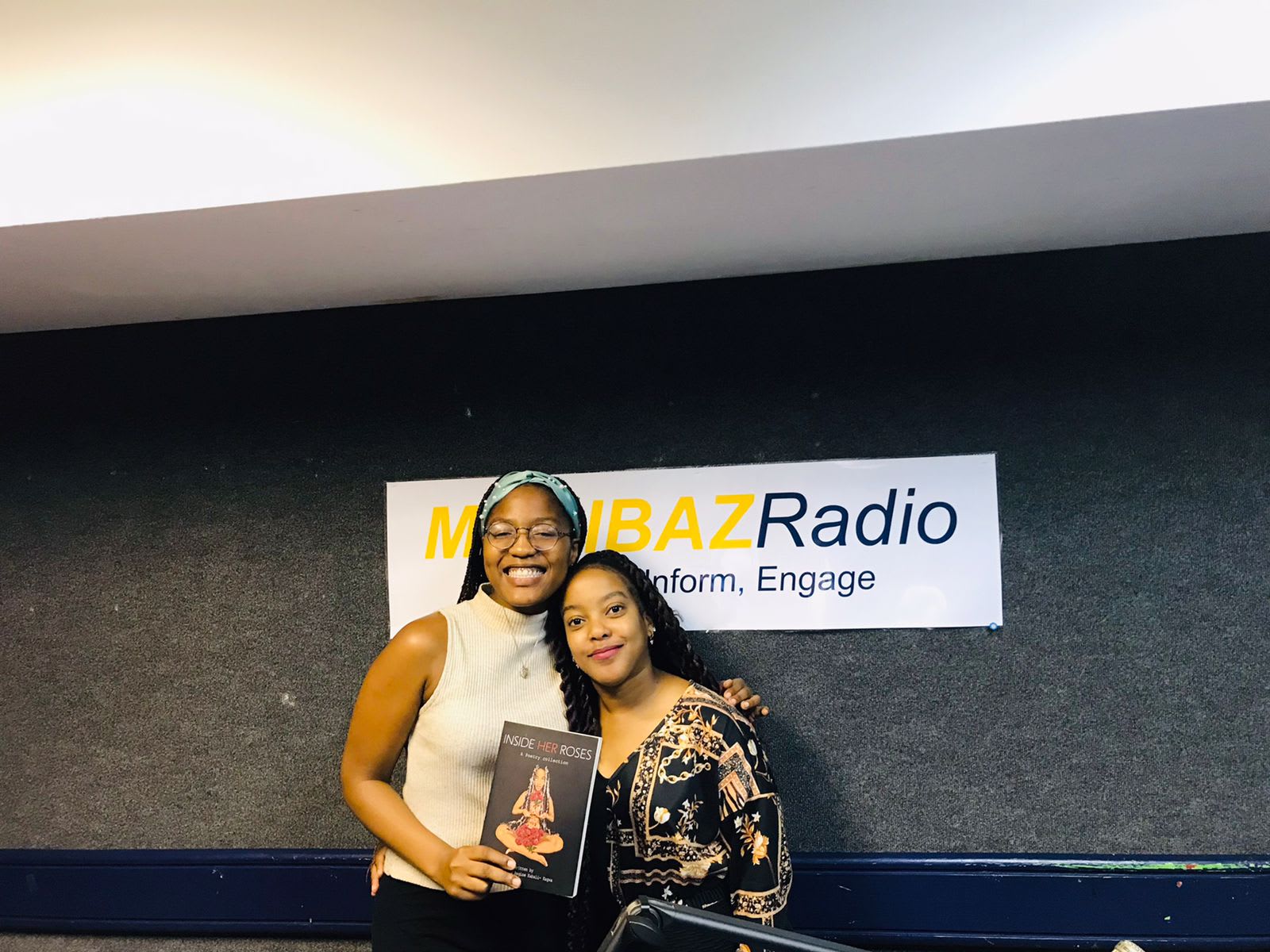 Beneath the Madibaz Radio banner