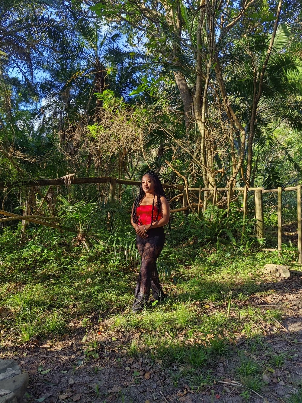 Nanda in a sunlit forest clearing, and her collection Inside Her Roses