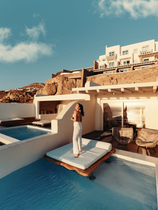 Golden hour resort pool photography by Filippo Bellisola