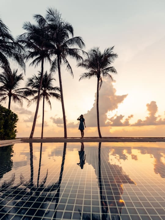 Sunset infinity pool resort photography by Filippo Bellisola