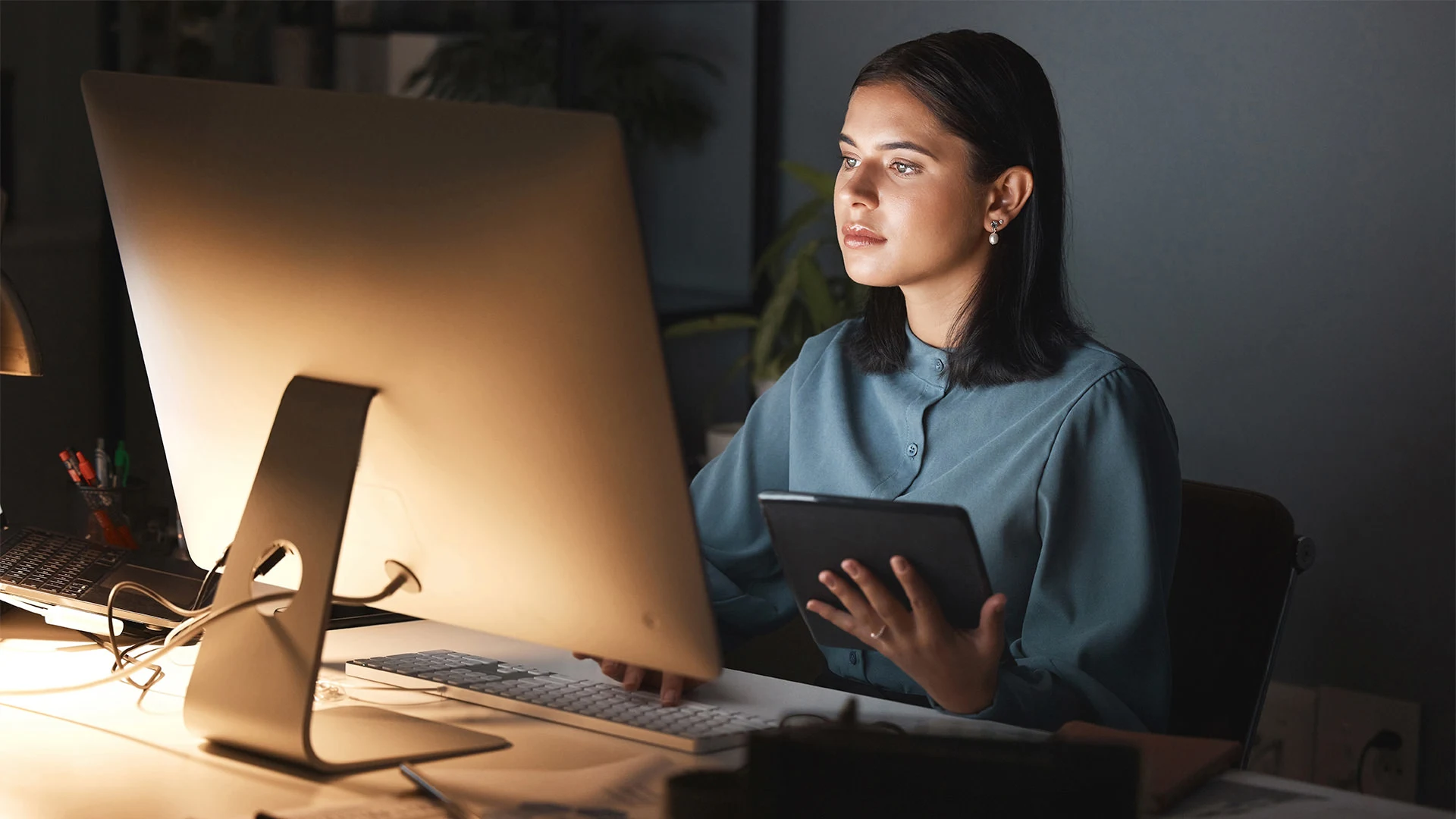 A young woman working on a computer.