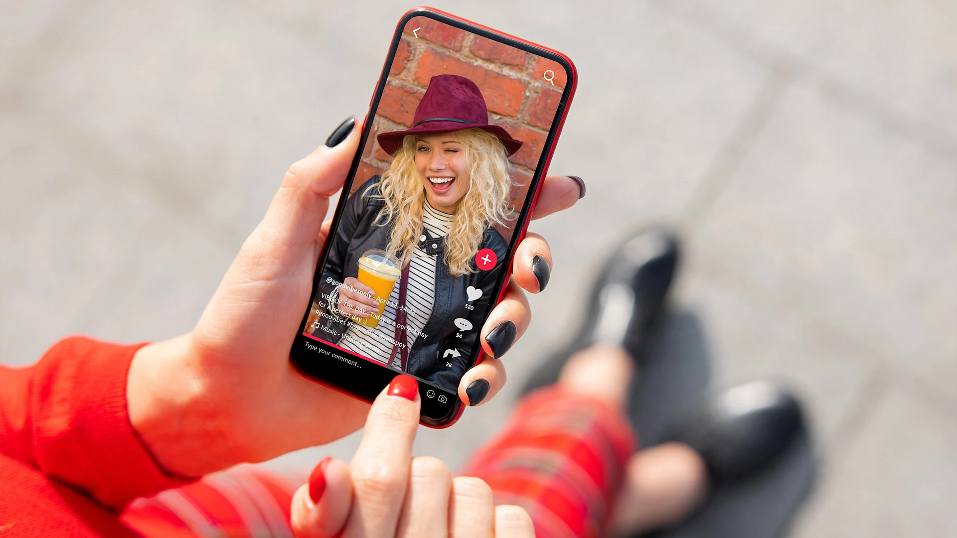 Woman watching a TikTok on her phone.