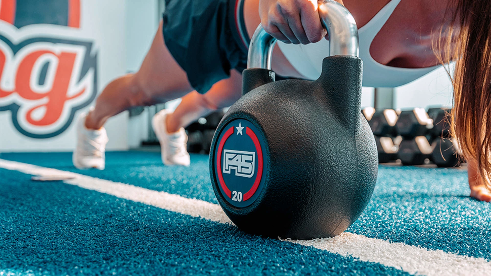 A woman training at F45