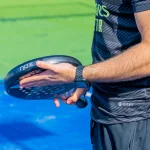 A man holding a Sky Padel bat.