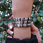 A woman wearing several bracelets from Nomination Italy Bahrain