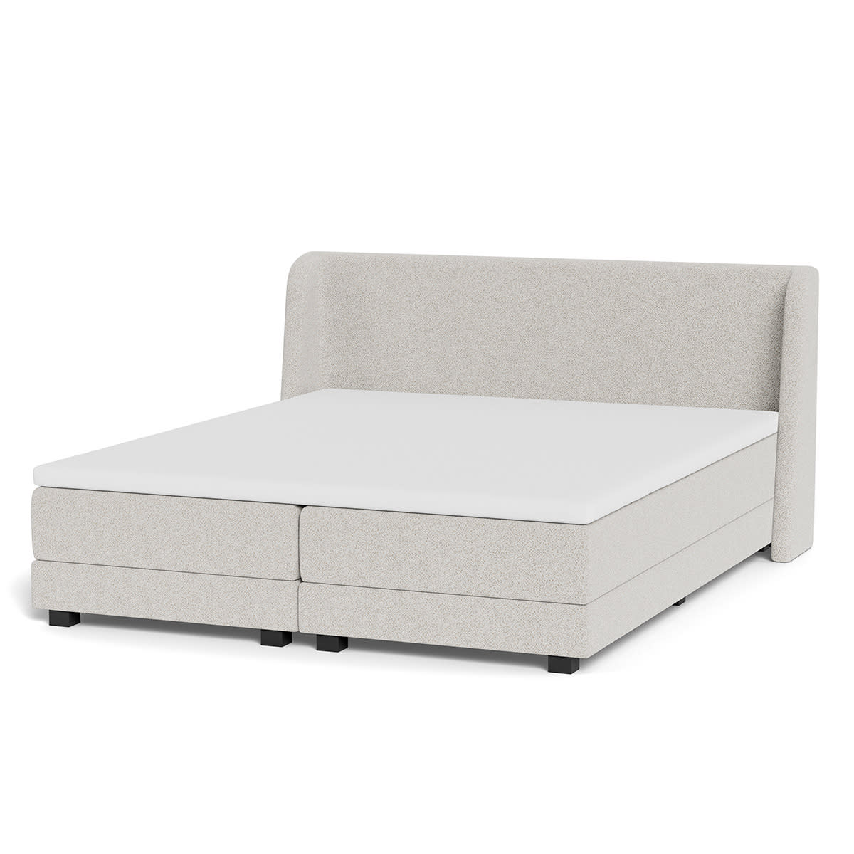 Beige kontinentalseng fra Dixxius med polstret sengegavl, komfortabel madras og hvid topmadras.