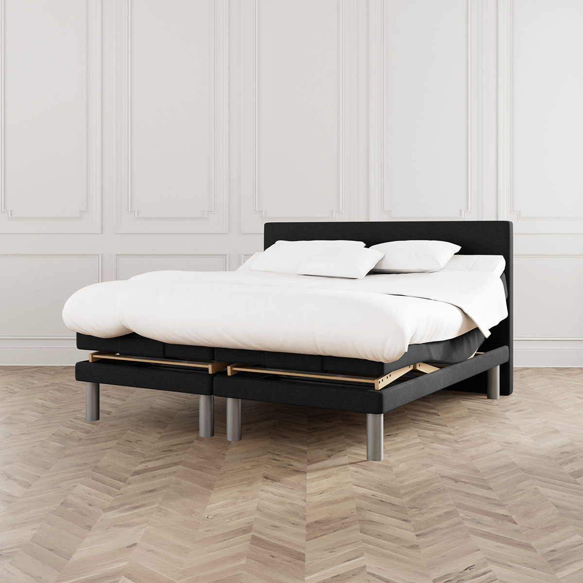 Sort elevationsseng fra MasterBed Standard i Dozy-serien med runde ben, set forfra.