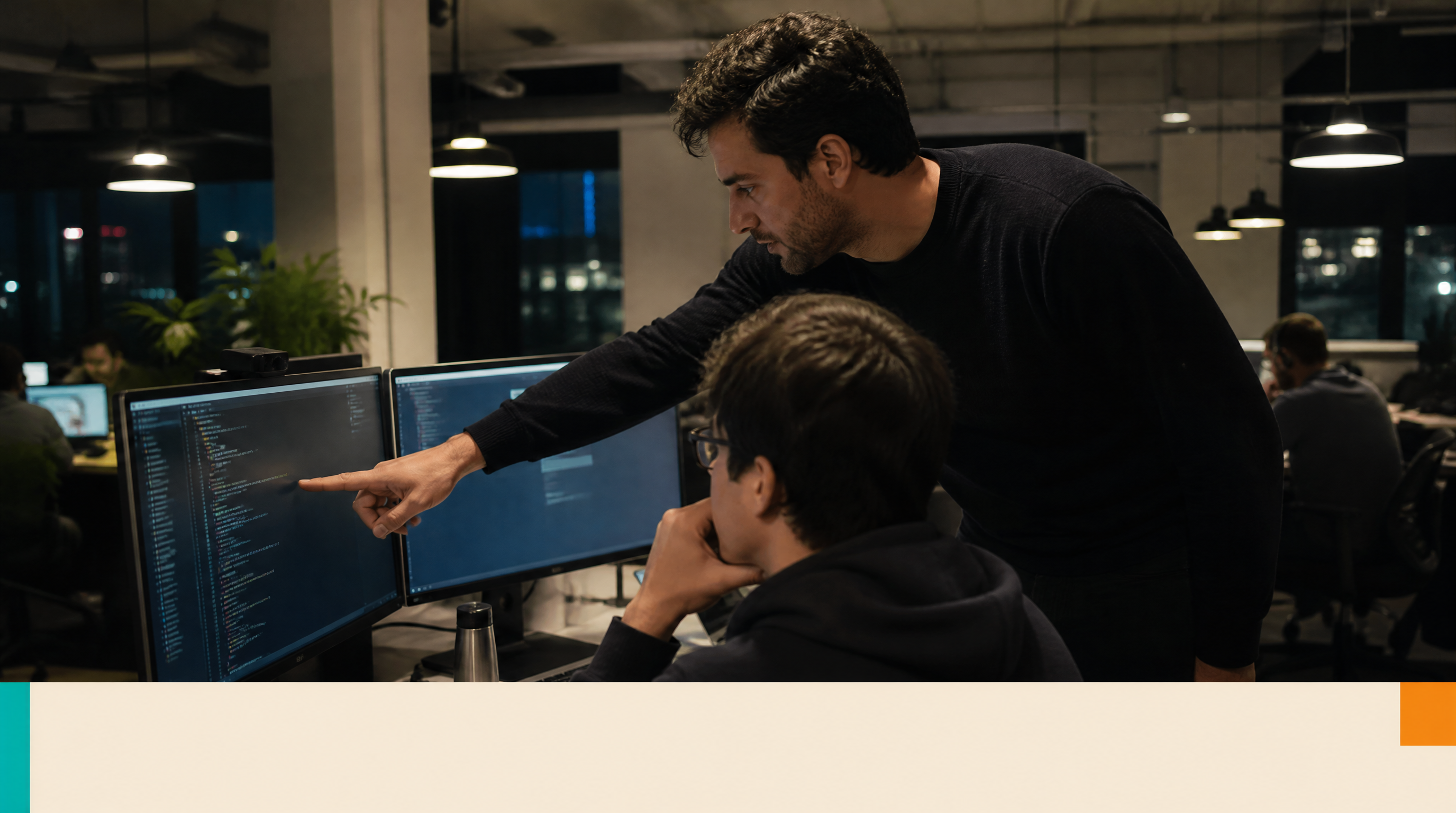 How Do AI Agents Learn? A Plain-English Guide for Small Business Owners — Supporting visual 1: A developer in his 30s leans over two monitors in a dimly li