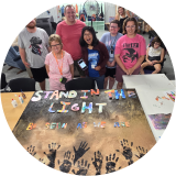 Stand in the light and be seen as we are