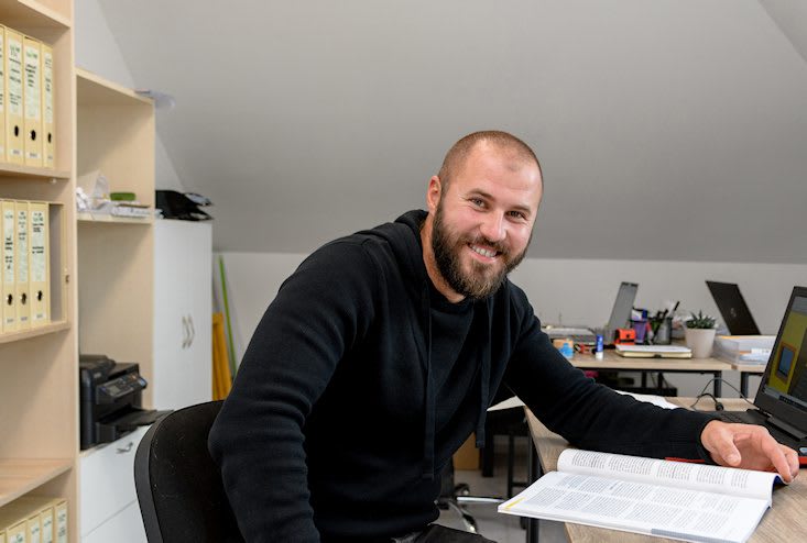 business young man sitting at desk