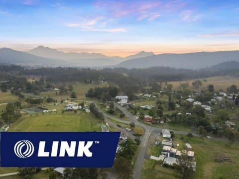 ¼ Acre with 2 Properties Prime Main Street Frontage Business