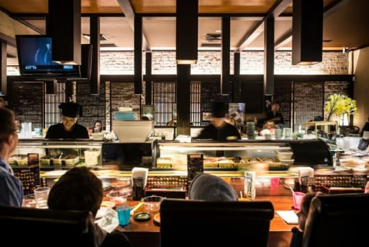 Busy Sushi train restaurant in new Commercial-Residential Complex building in Clayton