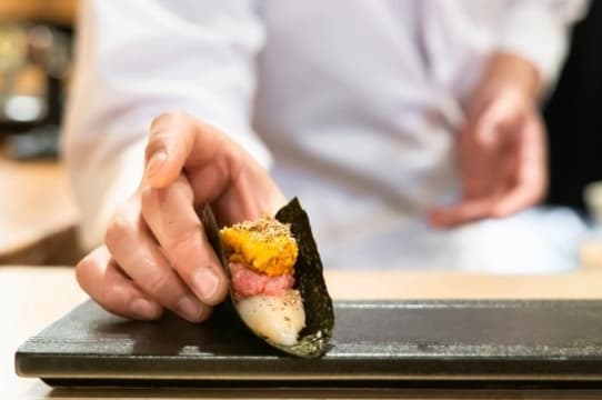 Busy Sushi train restaurant in new Commercial-Residential Complex building in Clayton