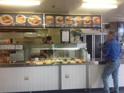 Johnos BBQ chickens salads and seafood