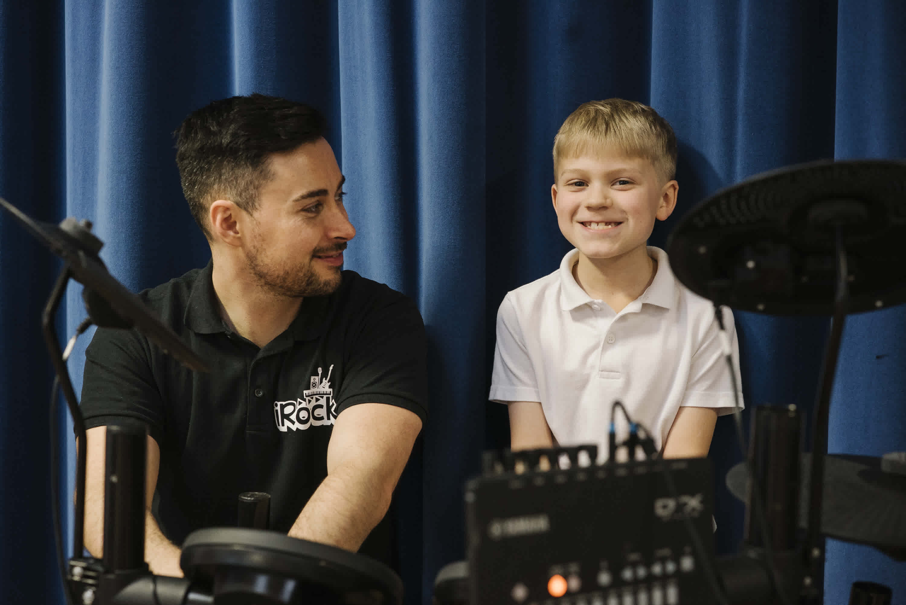 irock coach and band student smiling