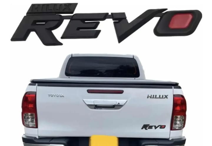 Emblema Negro Palabra Revo und. - Car Zone Accesorios Honduras